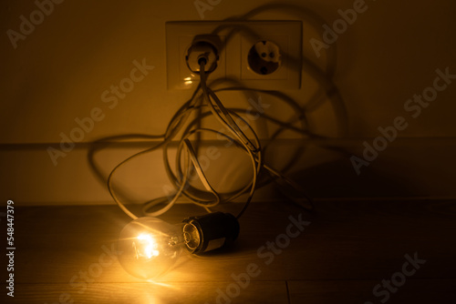 a light bulb with the cord lit.