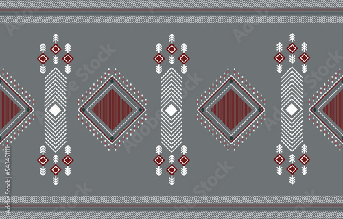 Oriental ethnic seamless pattern traditional background Design for carpet,wallpaper,clothing,wrapping,batik,fabric,Vector illustration embroidery style. Grey background.