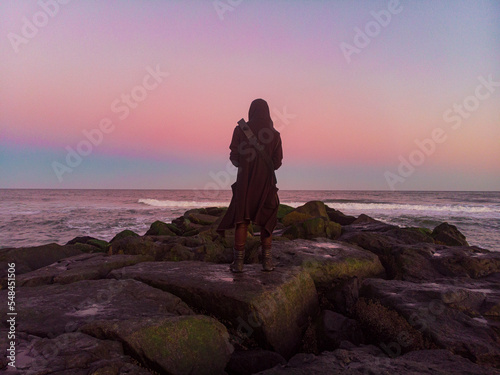 overlooking ocean on jetty at sunset in asbury park new jersey photo