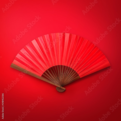 Red Chinese folding fan on red color background