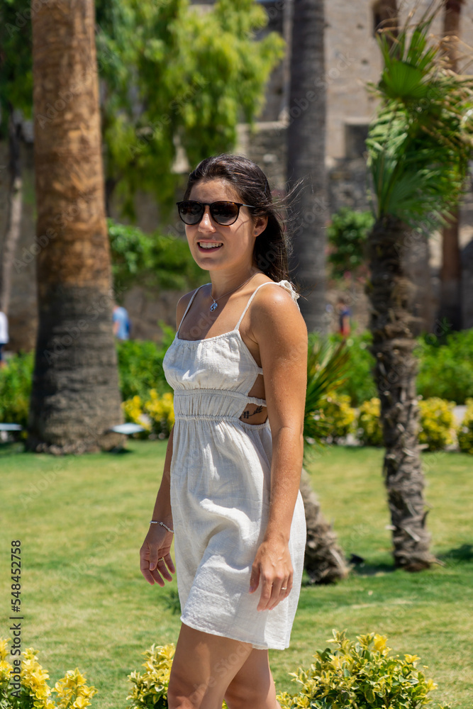 Young woman tourist in the city of Cesme, Turkey Young woman tourist in the city of Cesme, Turkey