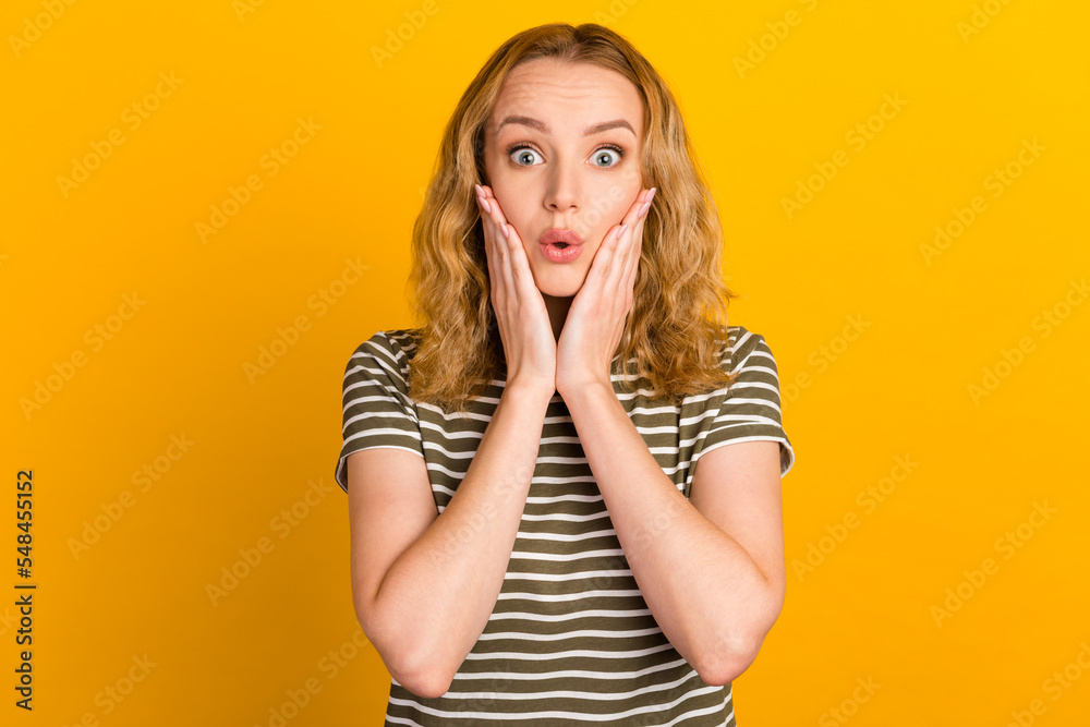 Photo of young attractive girl shocked surprised fake novelty news isolated over shine color background Photo of young attractive girl shocked surprised fake novelty news isolated over shine color background