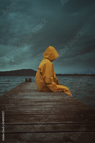 Mysterious figure with yellow coat