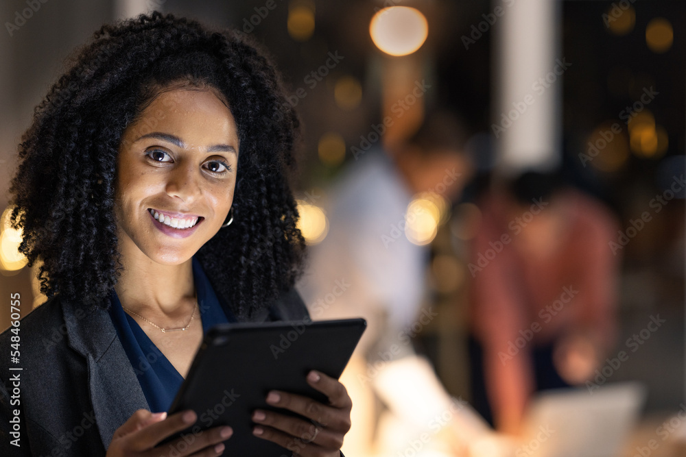 Face, tablet and night with a business black woman at work overtime late in her company office. Portrait, technology and dark with a female employee working to finish a task or project by deadline Face, tablet and night with a business black woman at work overtime late in her company office. Portrait, technology and dark with a female employee working to finish a task or project by deadline