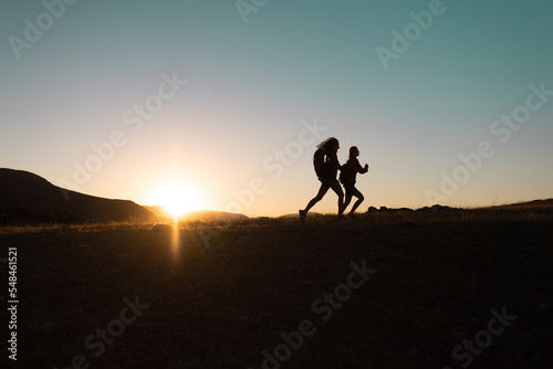 Running people over rough terrain. © zhukovvvlad