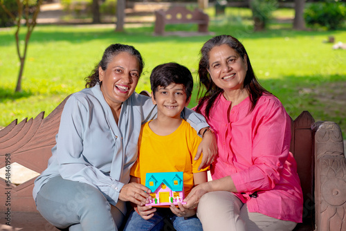 Happy grandmother with grandson together at garden.