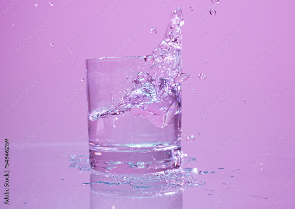 ice cube falling into water with splash ice cube falling into water with splash