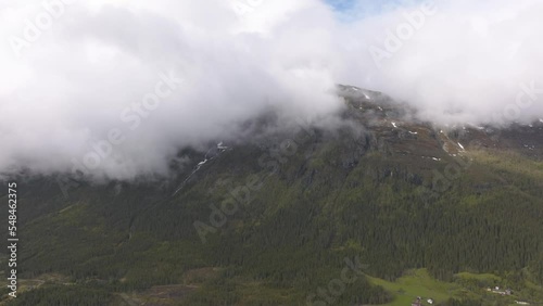 Cloudy mountain in Norwegian valley photo