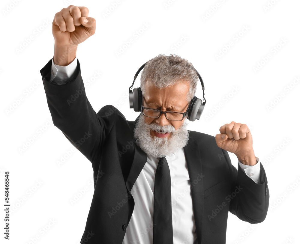 Senior bearded man in suit and headphones dancing on white background Senior bearded man in suit and headphones dancing on white background
