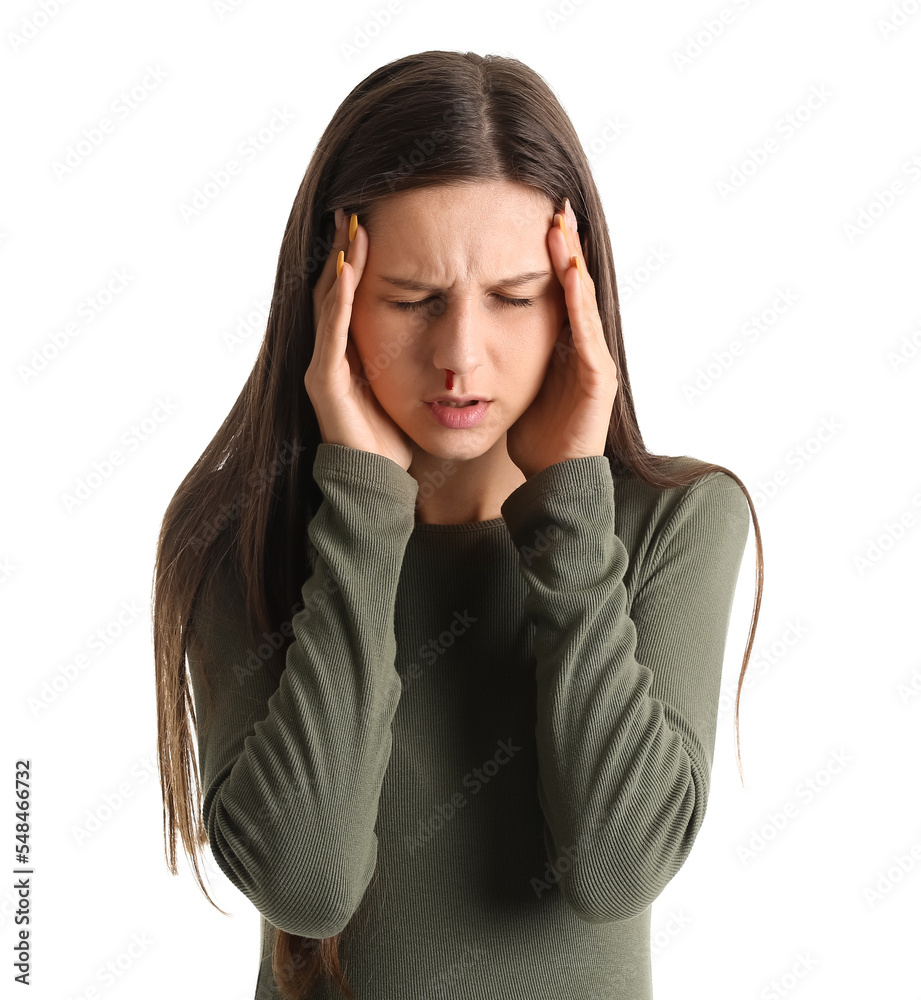 Young woman with nosebleed on white background Young woman with nosebleed on white background
