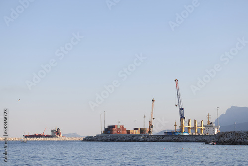 Sea side view on industry sea port on mountain background