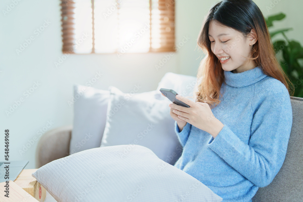 Portrait of a beautiful Asian teenage girl using a smartphone mobile Portrait of a beautiful Asian teenage girl using a smartphone mobile