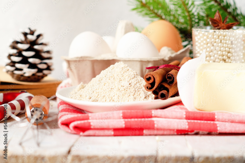 Bakery background with ingredients for cooking Christmas baking. Flour, brown sugar, butter, eggs
and spices on the table Bakery background with ingredients for cooking Christmas baking. Flour, brown sugar, butter, eggs
and spices on the table