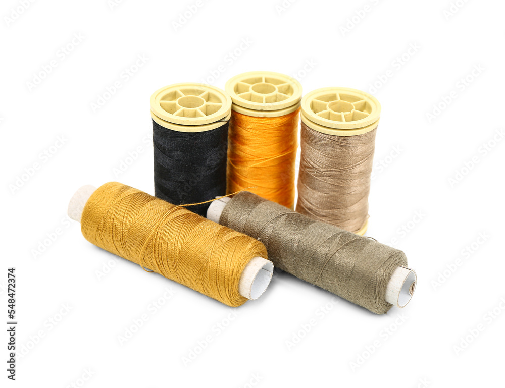 Different thread spools isolated on white background Different thread spools isolated on white background