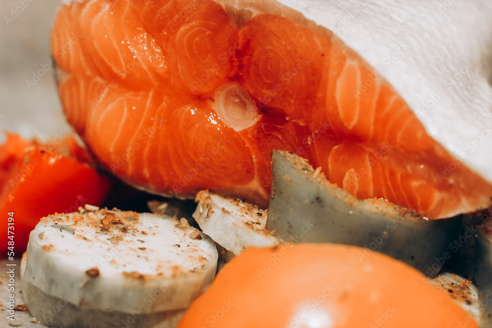 Red fish trout salmon ready for baking with vegetables. Red fish trout salmon ready for baking with vegetables.