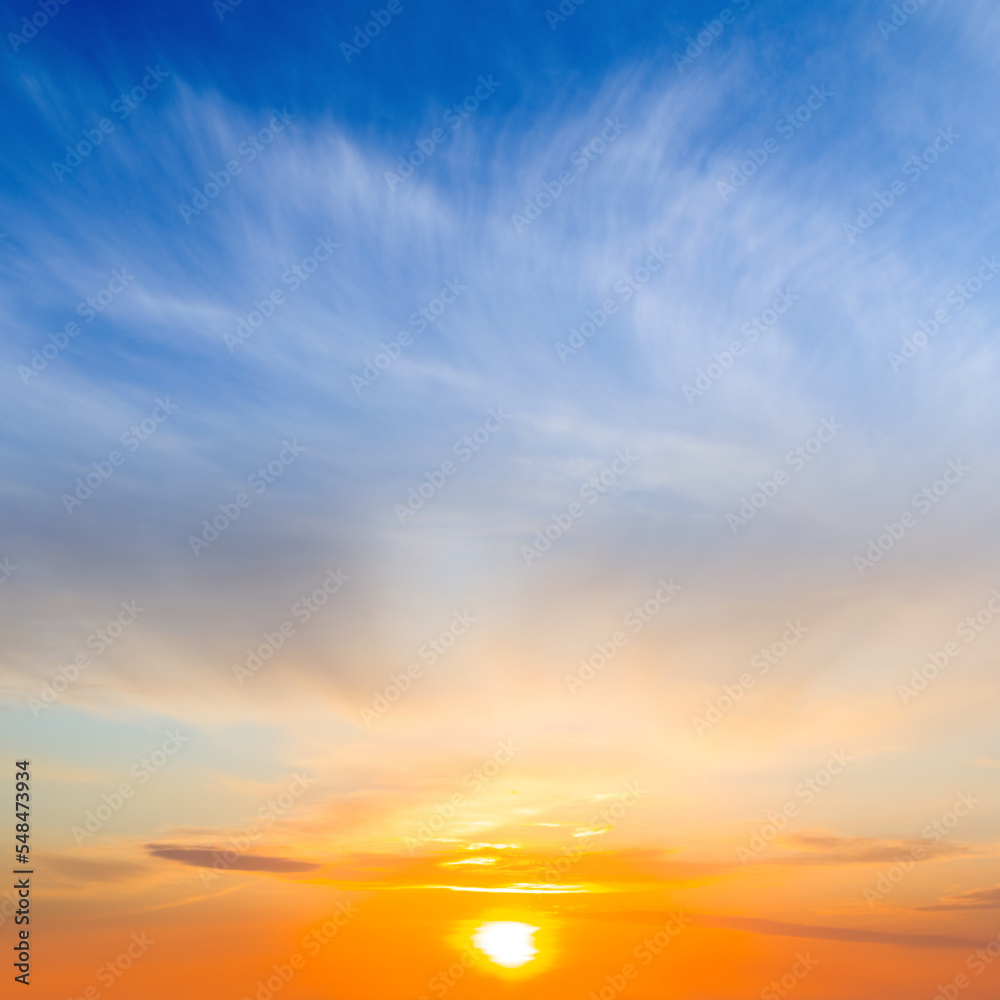 dramatic sunset on blue cloudy sky background
