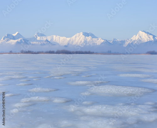 frozen and snowbound mountain valley, winter mountain travel landscape © Yuriy Kulik