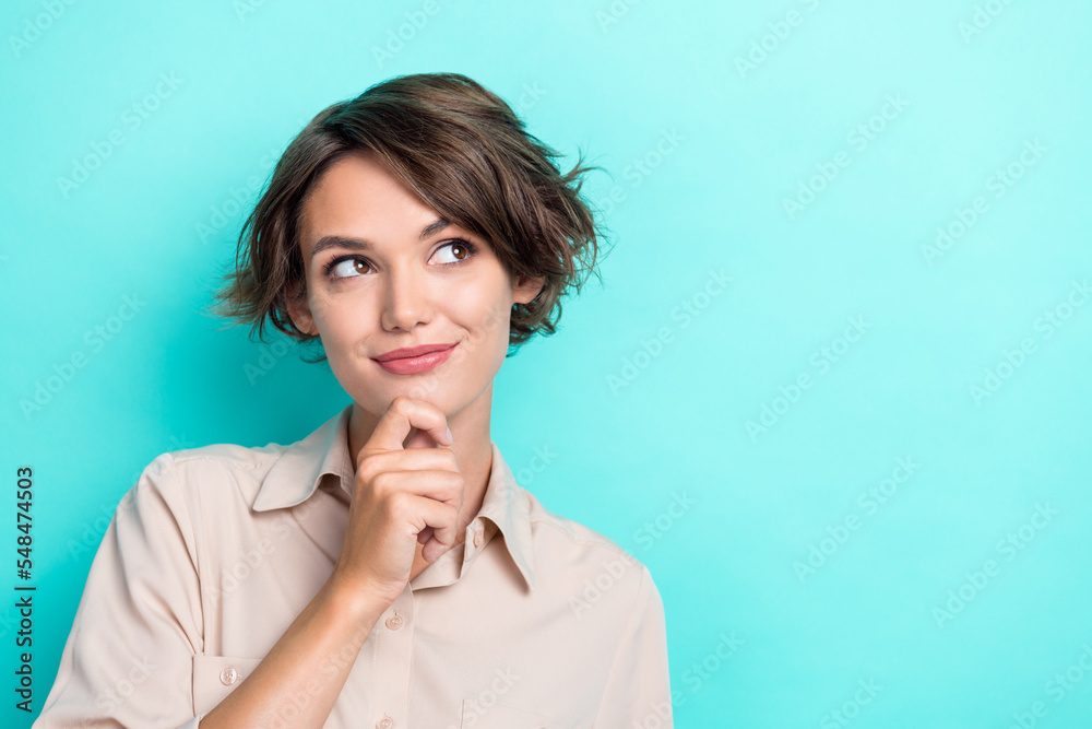 Closeup portrait photo of charming bob brown hair girlish lady manager touch chin minded look interested empty space isolated on cyan color background Closeup portrait photo of charming bob brown hair girlish lady manager touch chin minded look interested empty space isolated on cyan color background