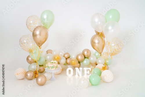 One year decoration in gold and green colors