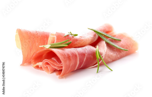 Slices of delicious ham with rosemary on white background