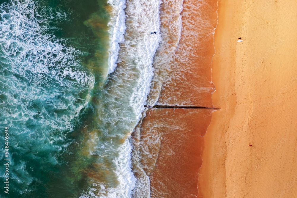 Aerial view of beach with surfers Aerial view of beach with surfers