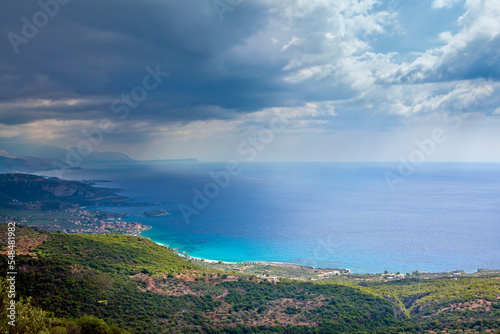 Beautiful panoramic landscape with dark clouds ready to bring rain comes over Kardamyli town, in eastern Messinia region, in Peloponnese, Greece, Europe. 