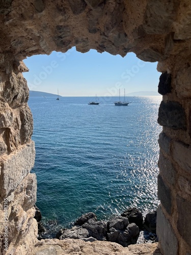 Fortress at the Aegean sea, blue sea, stone walls