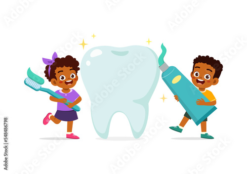 little kid and friend cleaning big tooth