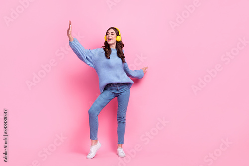 Full length portrait of overjoyed positive person chilling dancing listen favorite playlist isolated on pink color background