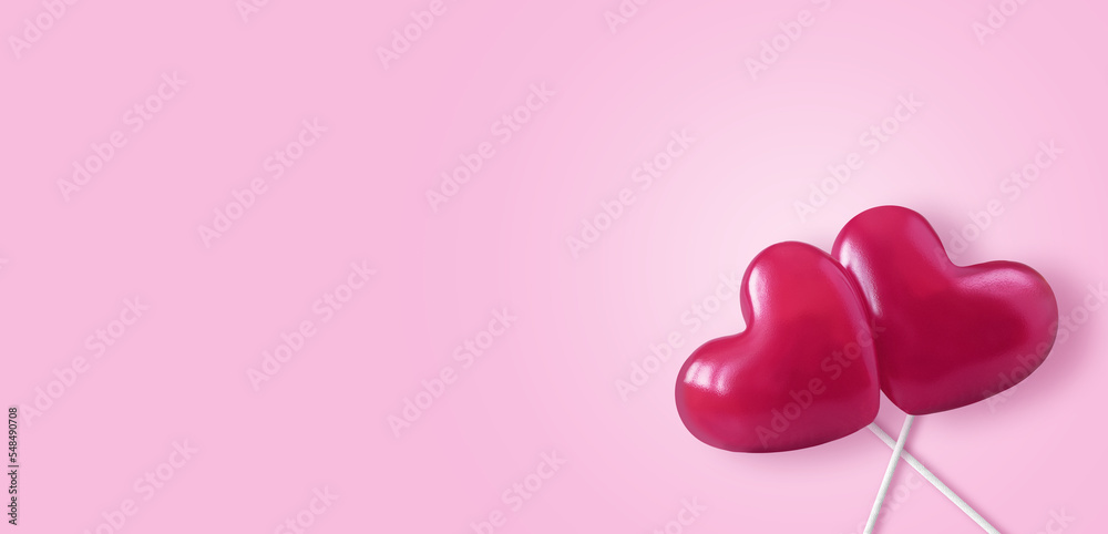 Two pink Valentine's day heart on empty pastel pink paper background. Love concept, top view. Minimalism style.