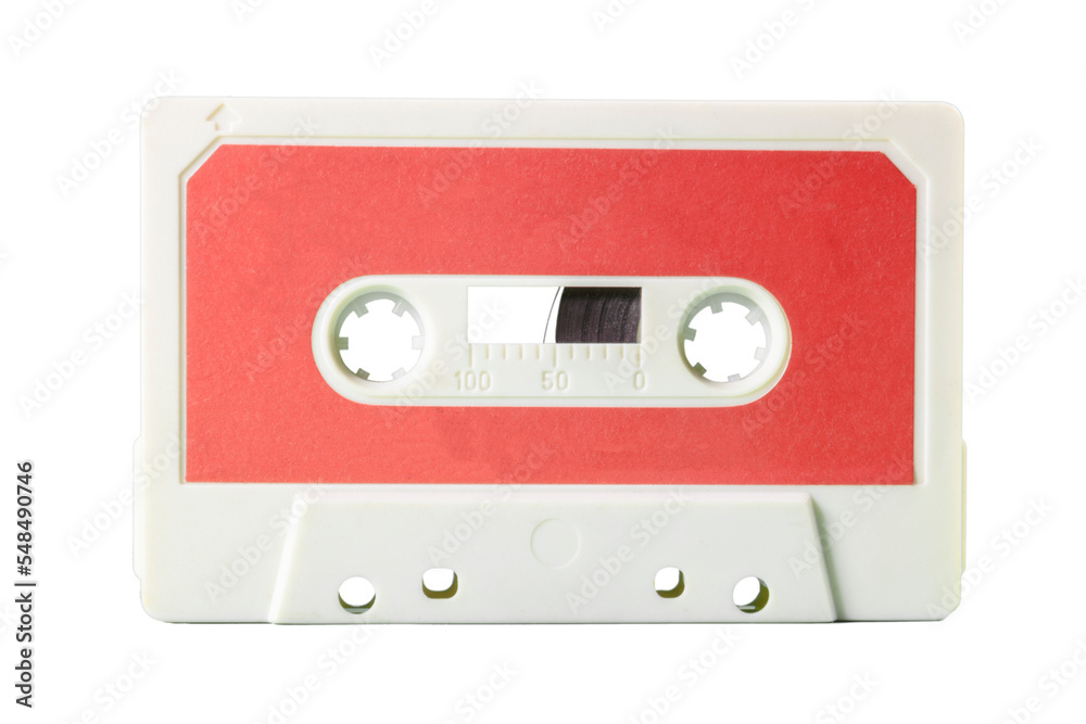 Isolated closeup front shot: an old vintage cassette tape (obsolete music technology). Cream red peach label over a white plastic body.
