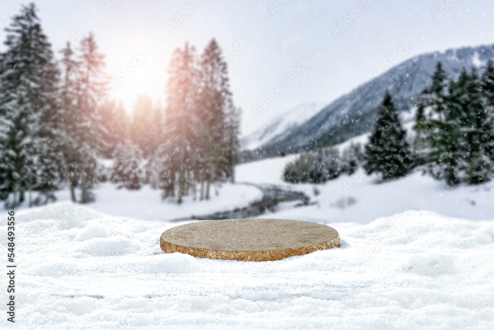 Obraz premium A minimalist composition with snow, against the background of a beautiful winter landscape and free space