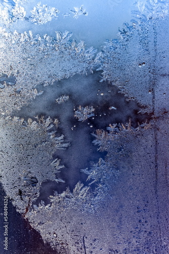 Frosty drawing on the window close-up in winter © Александр Коликов