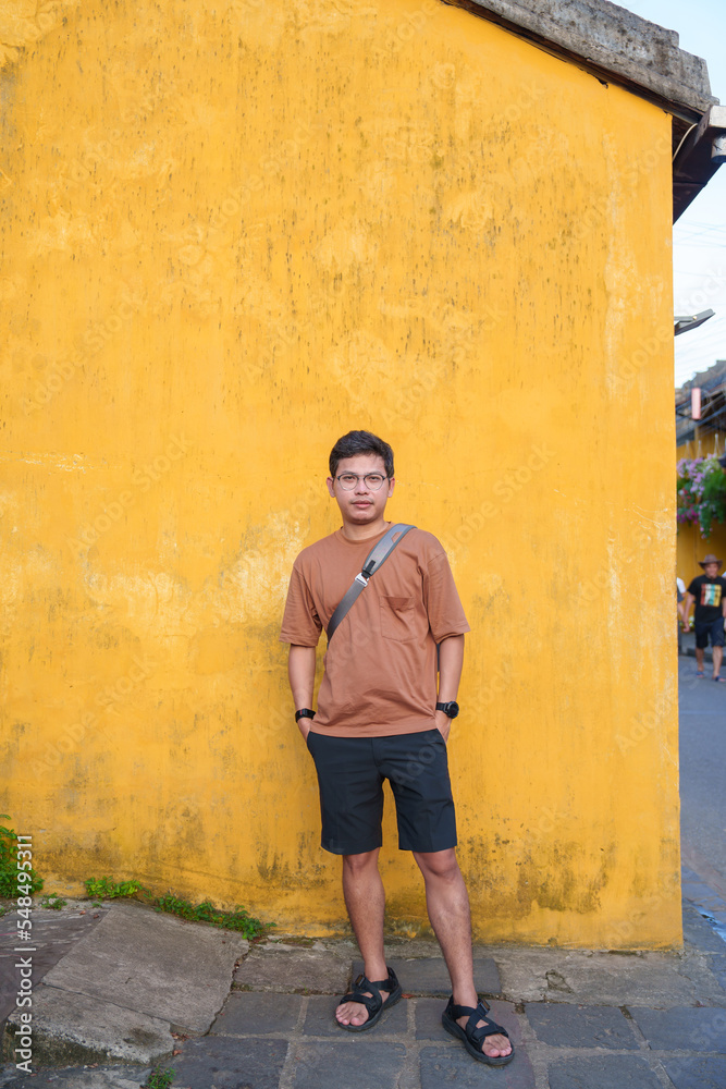 happy traveler traveling at Hoi An ancient town in Vietnam,. landmark and popular for tourist attractions. Vietnam and Southeast Asia travel concept happy traveler traveling at Hoi An ancient town in Vietnam,. landmark and popular for tourist attractions. Vietnam and Southeast Asia travel concept