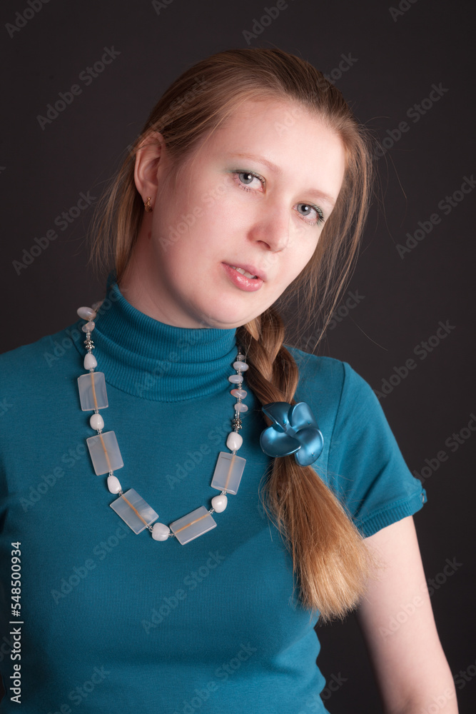 studio portrait of a girl with a braid