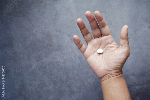 top view of man hand holding pills with copy space 