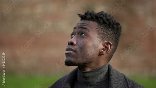 Thoughtful black African man portrait face close-up, tracking shot