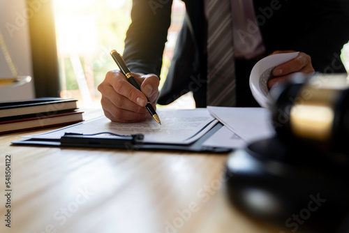 Papier peint Attorneys or lawyers businessman working or reading lawbook in office workplace for consultant lawyer concept