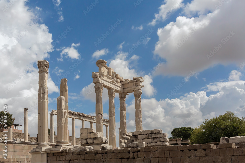 The ruined Temple of Trajan in Pergamon Ancient City. Corinthian order, II century AD. Beautiful clouds at background. History, art or architecture concept. Bergama, Turkey