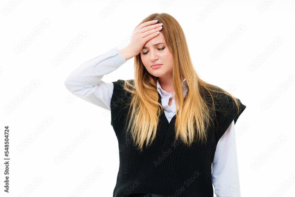 blonde keeps hand on head. migraine or headache blonde keeps hand on head. migraine or headache