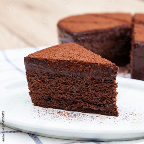 A slice of classic soft and rich chocolate cake