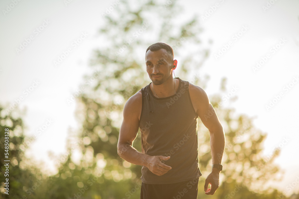 young handsome man is engaged in jogging on the street in sportswear, sports lifestyle, jogging on the street. young handsome man is engaged in jogging on the street in sportswear, sports lifestyle, jogging on the street.