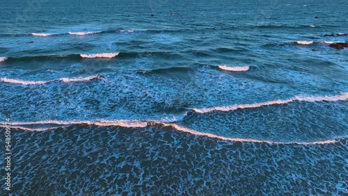 Waves at sunset on the Trengandin beach. Aerial view from a drone of the beach in the surroundings of Noja. Natural Park of the Marshes of Santoña, Victoria, Noja and Joyel. Cantabrian Sea. Cantabria.