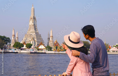Photography Couple Looking at the Iconic Stupa of Temple of Dawn or Wat Arun, a Famous Landm