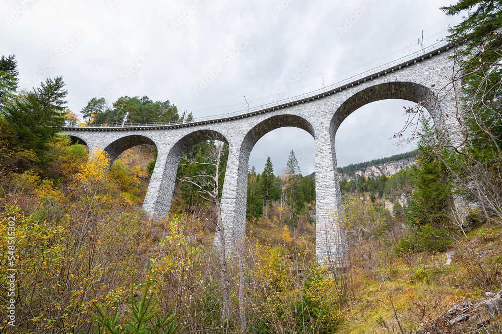 Stunning wide angle view of a large railway viaduct near the Swiss town of Filisur in Graubünden canton, Switzerland.