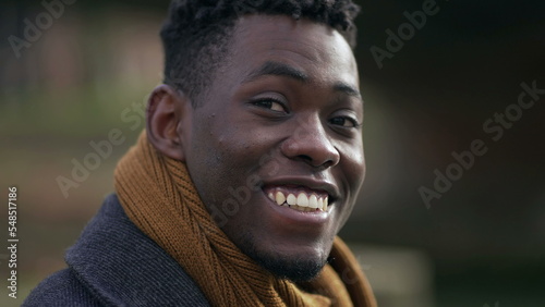 Young handsome black African man portrait looking at camera wearing winter clothing