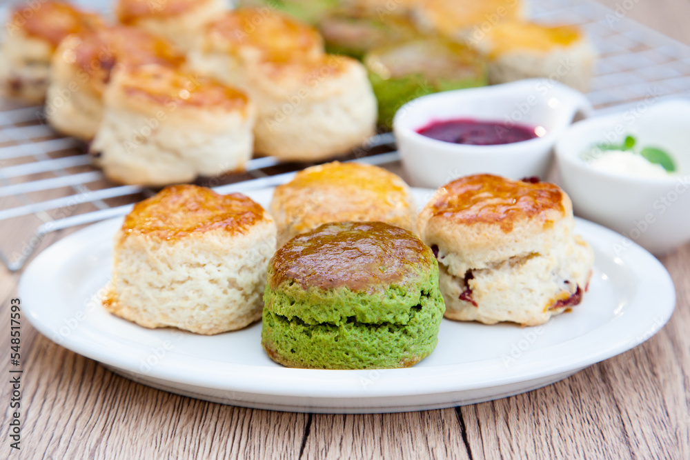 Four flavours of homemade scone with raspberry jam and clotted cream (butter, cranberry, matcha and Earl Grey)