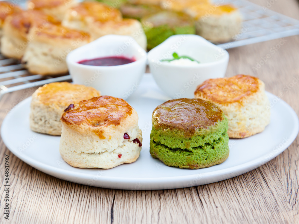 Four flavours of homemade scone with raspberry jam and clotted cream (butter, cranberry, matcha and Earl Grey)