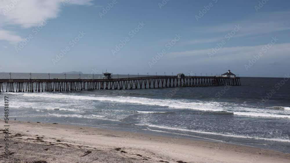Pier Of Imperial Beach Of Waves Splashing Onto The Shore In Summer In San Diego, California, USA. slow motion Pier Of Imperial Beach Of Waves Splashing Onto The Shore In Summer In San Diego, California, USA. slow motion