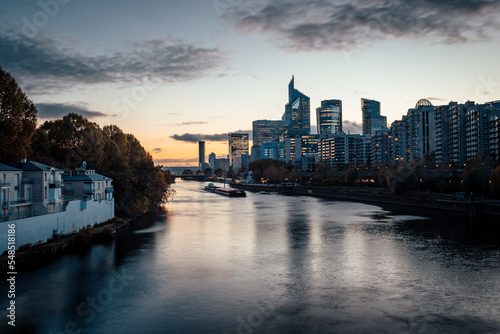 The seine River in Paris and the buildings that are build across it giving a nice reflection and a beautifull sunset/sunrise	
 photo